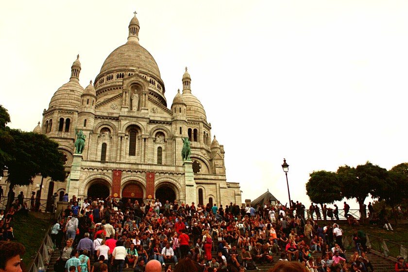 Crowds of people sitting in front of the Sacre-Coeur taking in the amazing views!