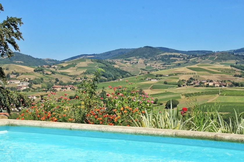 Holiday in Ternand France, view by the swimming pool of the countryside